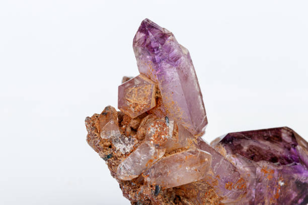 istock macro mineral stone Amethyst on smoky quartz on a white background 1189574421