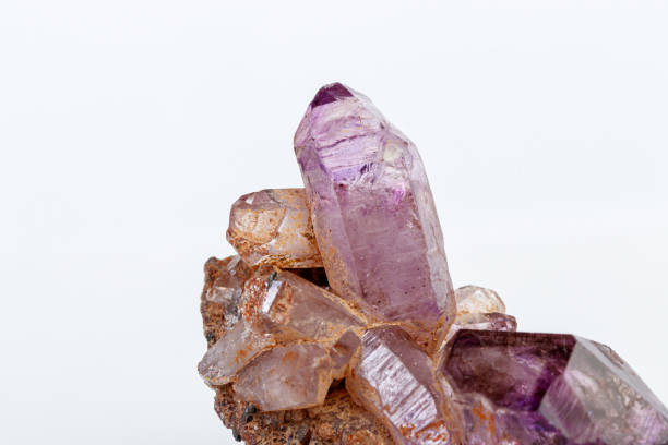istock macro mineral stone Amethyst on smoky quartz on a white background 1189574523