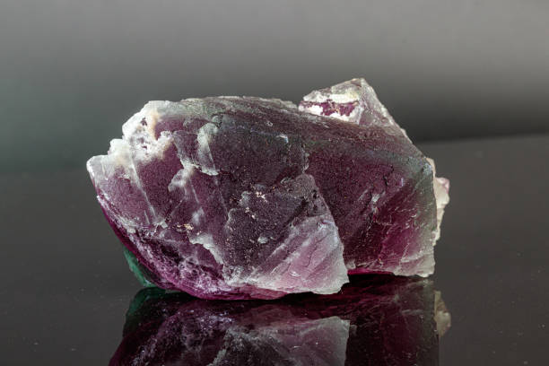 istock macro mineral stone red and green fluorite on a black background 1189574540