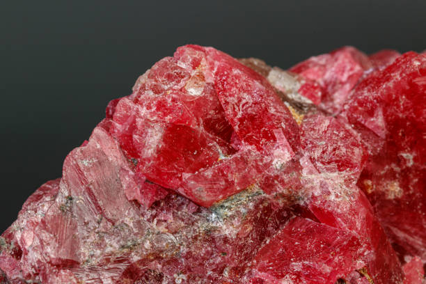 istock macro mineral stone Rhodochrosite on a black background 1189574548