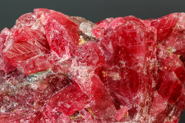 istock macro mineral stone Rhodochrosite on a black background 1189575072
