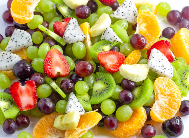 istock Healthy fresh fruit salad on white background. Top view.Fruit background,Closeup 1189576428