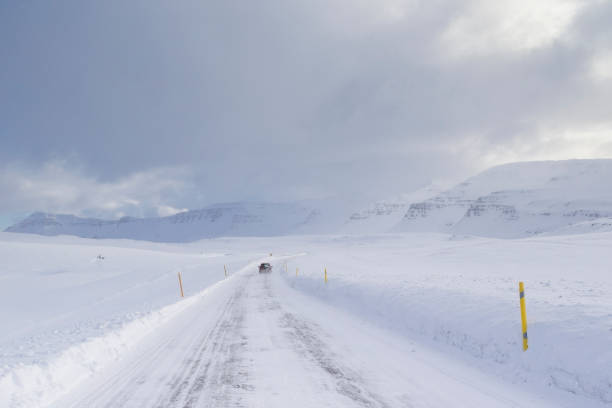 istock country road on a winter day 1189576624