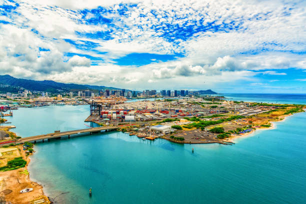 Honolulu, United States - June 18, 2017:  Wide angle view of the skyline of downtown Honolulu, Hawaii beyond the Port of Honolulu from an altitude of about 600 feet during a helicopter photo flight of the city.