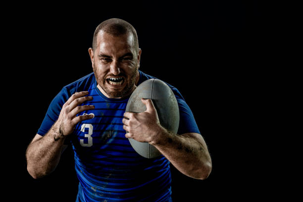 istock Rugby player holding ball 1189578688