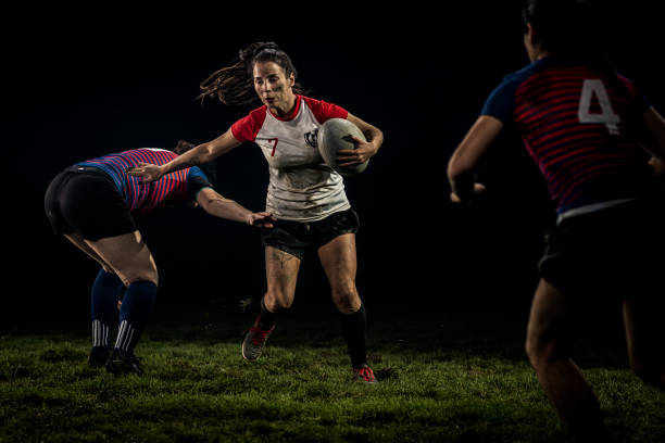 istock Women playing rugby on field 1189578697