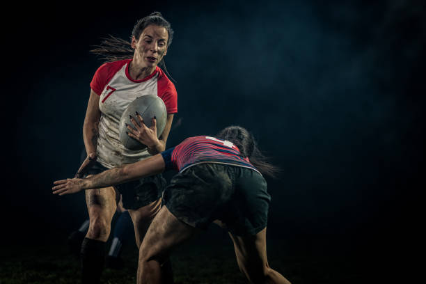 istock Women playing rugby on field 1189578699