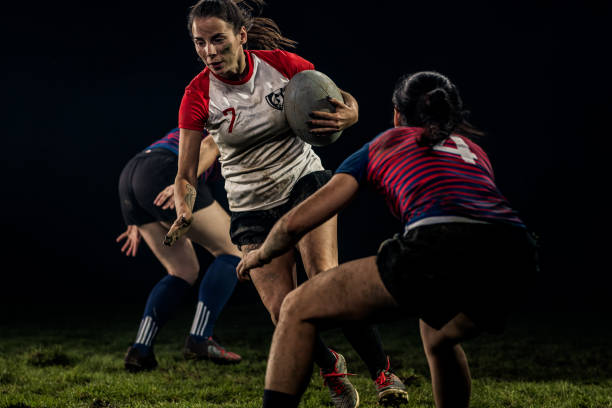 istock Women playing rugby on field 1189578703