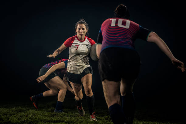 istock Women playing rugby on field 1189578709