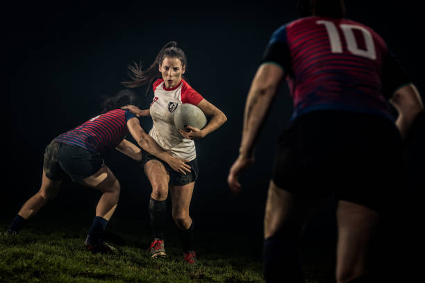 istock Women playing rugby on field 1189578710