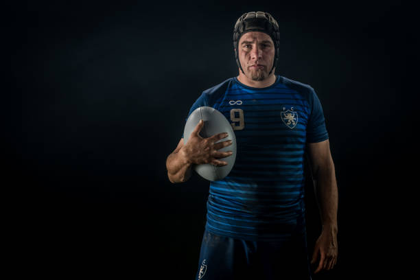 istock Rugby player holding ball 1189578727