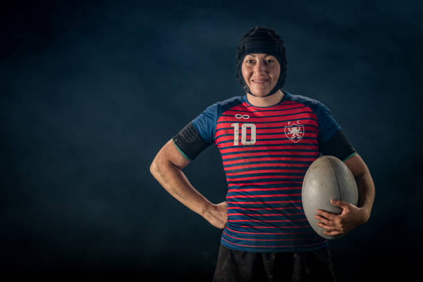 istock Female rugby player holding ball 1189578736