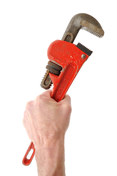 pipe wrench in der hand hält - adjustable wrench wrench isolated work tool stock-fotos und bilder