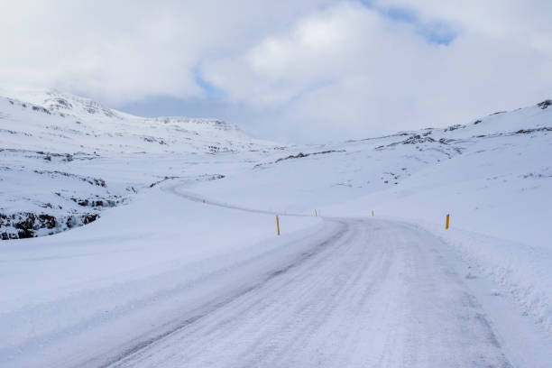istock country road on a winter day 1189579954