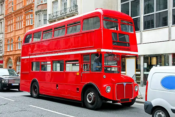 Red double deck bus at heritage route in London.