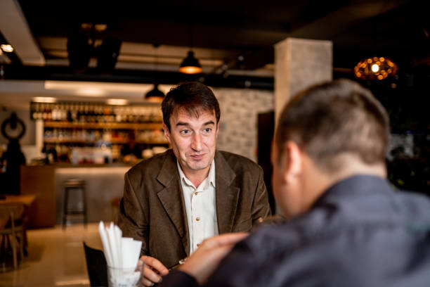 istock Two business people working in restaurant 1189581162