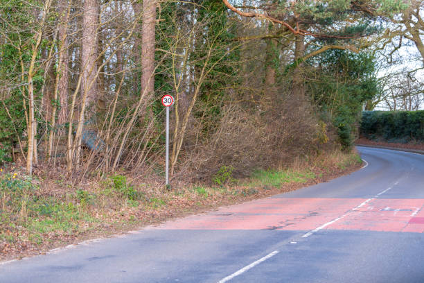 istock Empty road with speed limit sign in Aspley Guise, Milton Keynes 1189582417