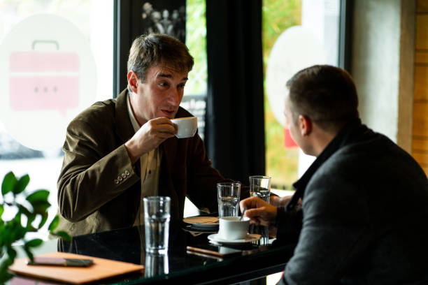 istock Two business people working in restaurant 1189583772