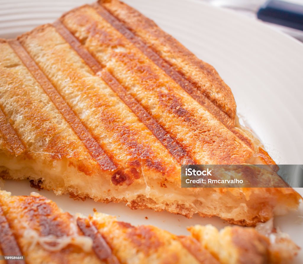 Photo of a grilled hot cheese sandwich. Typical brazilian snack. Awe Stock Photo