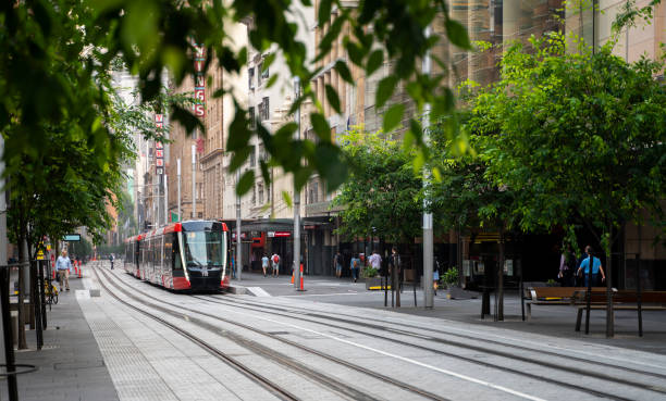 Sydney Light Rail infrastructure project nears completion and commences testing on George Street. Sydney, Australia - November 2, 2019: Sydney Light Rail infrastructure project nears completion and commences testing on George Street. blurred motion street car green stock pictures, royalty-free photos & images