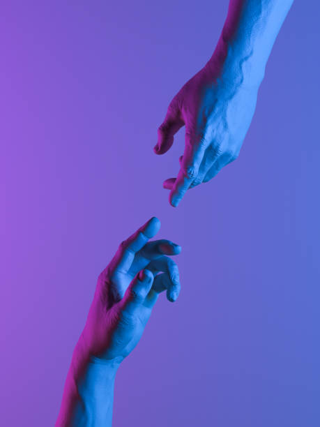 istock human hands in neon light Stretched towards each other as a symbol of connection between people. 3d rendering. 1189585582