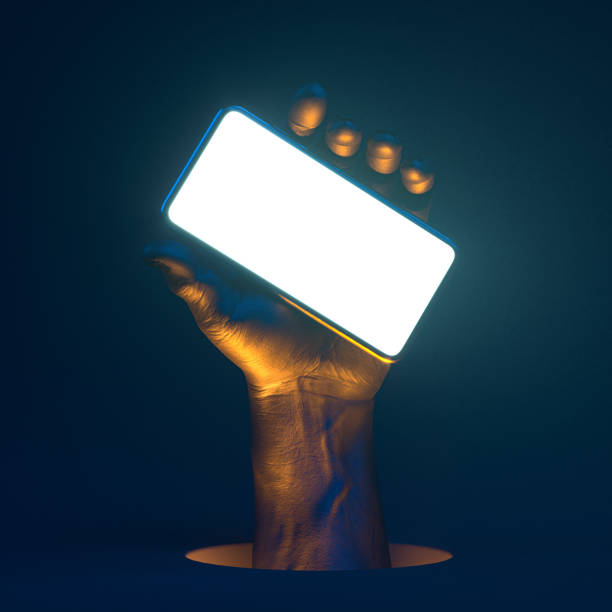 istock Golden neon human hand holding mobile phone with blank screen with empty space on dark background. 3d rendering 1189585645