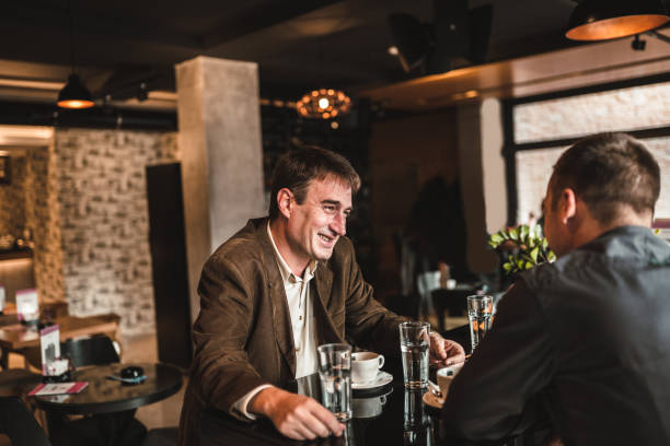 istock Two business people working in restaurant 1189585654