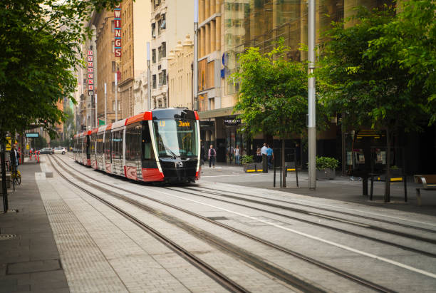 Sydney Light Rail infrastructure project nears completion and commences testing on George Street. Sydney, Australia - November 2, 2019: Sydney Light Rail infrastructure project nears completion and commences testing on George Street. blurred motion street car green stock pictures, royalty-free photos & images