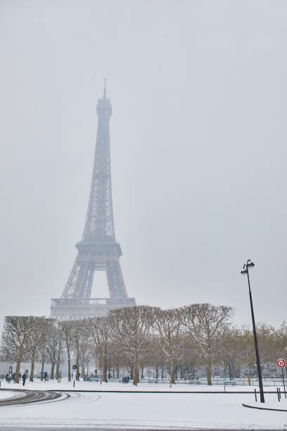 istock Scenic view to the Eiffel tower on a day with heavy snow 1189589411