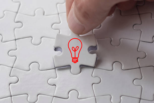 istock Finishing puzzle with new idea 1189589441