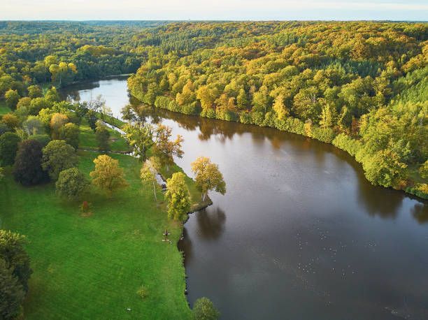 Scenic aerial view of a lake in autumn forest in northern France Scenic aerial view of a lake in autumn forest in northern France, Yvelines, France ile de france stock pictures, royalty-free photos & images