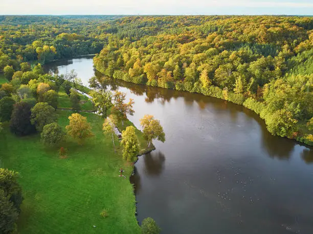 Scenic aerial view of a lake in autumn forest in northern France, Yvelines, France