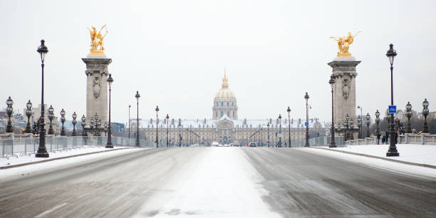 istock Pont Alexandre III and Invalides cathedral under snow 1189589780