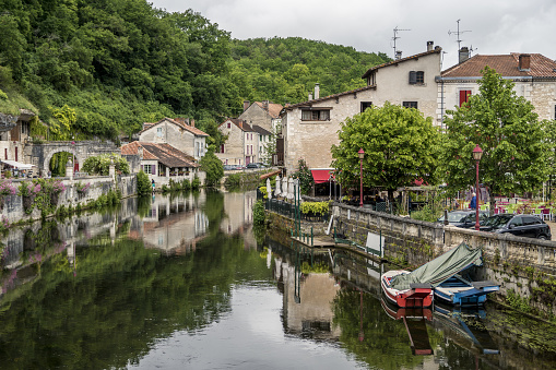 Blue summer morning: Historic Marburg viewed over Lahn river with foreground weir and background castle.