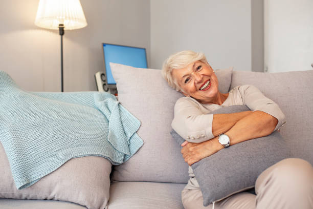 istock Smiling middle aged mature grey haired woman looking at camera 1189607207