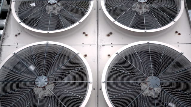 Tilting shot of some very large air conditioning fans