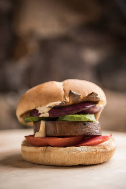 istock Vegan burger with vegetable tofu patty with copy space 1189613010