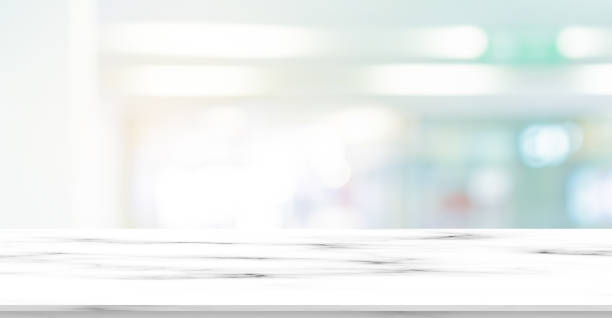 istock abstract blur inside modern interior office background with marble table for show , promote and advertise on display concept 1189616926