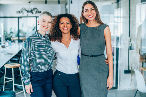 istock Happy businesswomen standing in office 1189618236