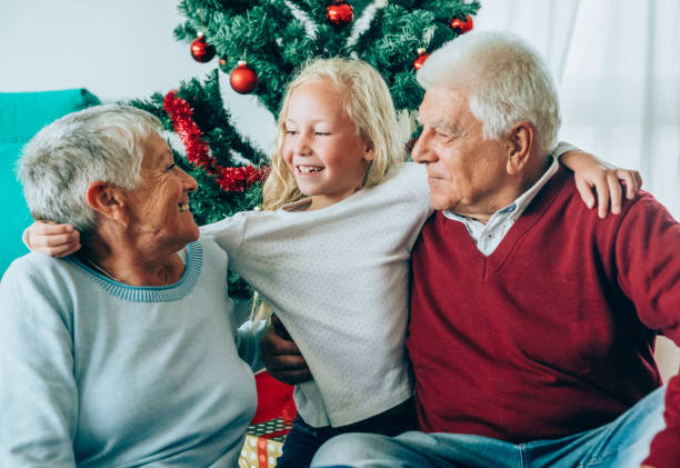 istock Happy grandparents with granddaughter 1189618538
