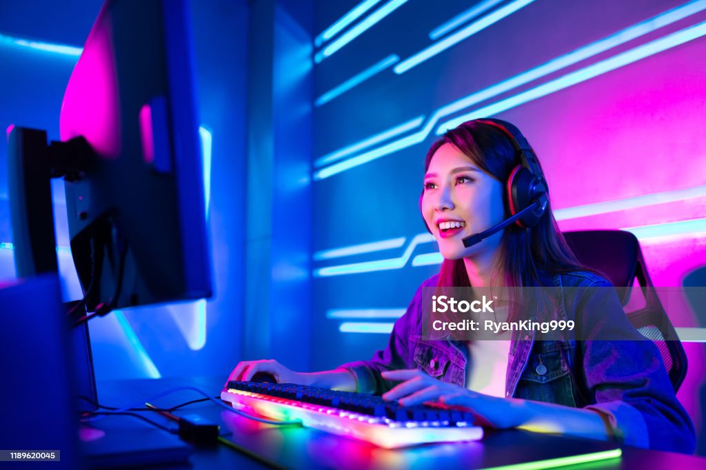 cybersport gamer have live stream Young Asian Pretty Pro Gamer having live stream and playing in Online Video Game Gamer Stock Photo
