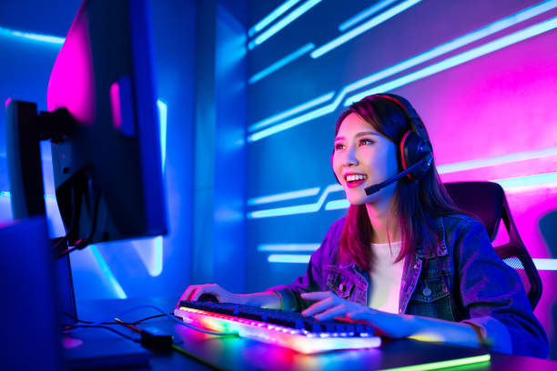 cybersport gamer have live stream Young Asian Pretty Pro Gamer having live stream and playing in Online Video Game gamer stock pictures, royalty-free photos & images