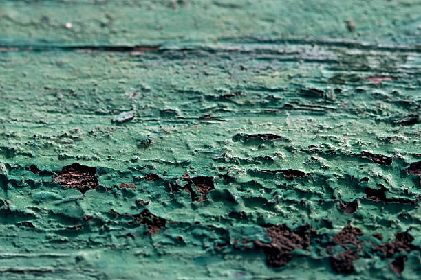 peeled off paint on a wooden surface stock photo