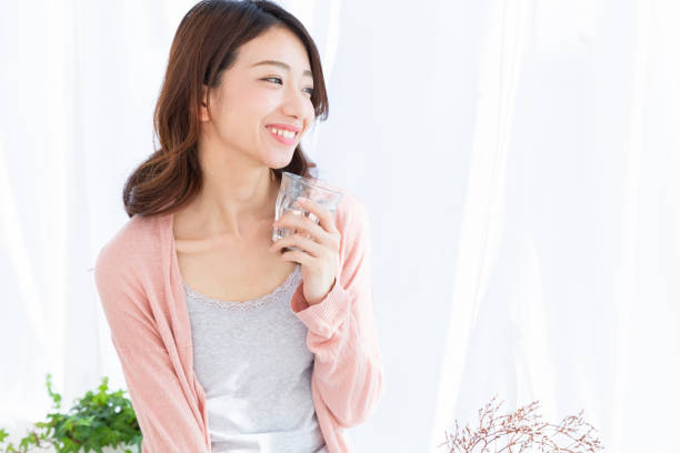 istock asian woman who drinks water 1189621433