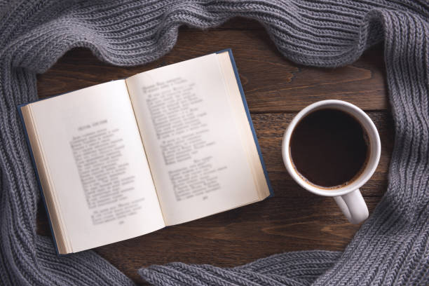 istock Autumn theme background with book and cup of coffe on dark wood table. Creative Flat layout and top view composition 1189621468