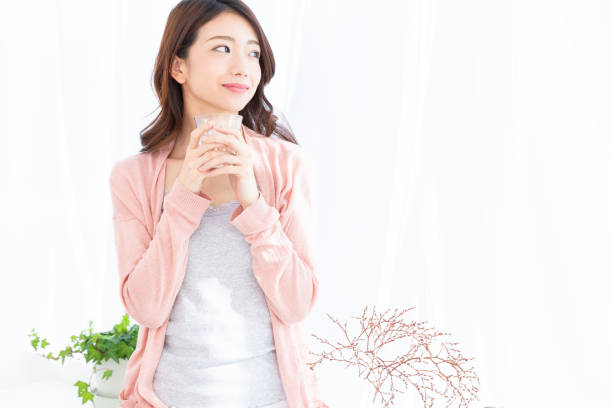 istock asian woman who drinks water 1189621511