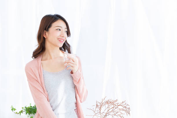 istock asian woman who drinks water 1189622033