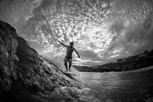 Black and White photo of a young surfer at Tamarama Beach, Sydney Australia