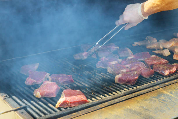 istock Juicy raw steaks grilling beef steak on the grill 1189642112
