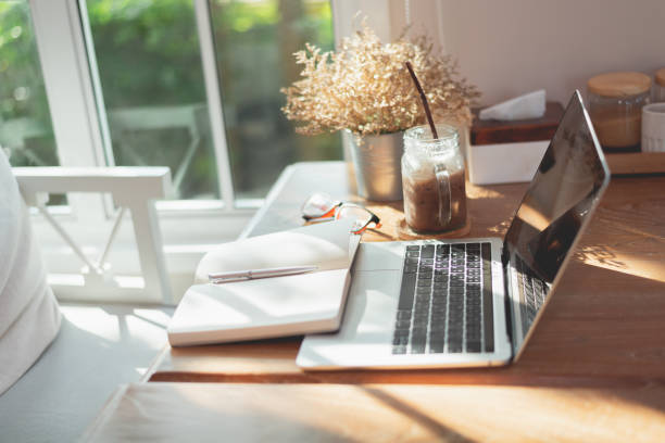 istock work space, laptop and note book on the table in the cafe, copy space business concept 1189654349